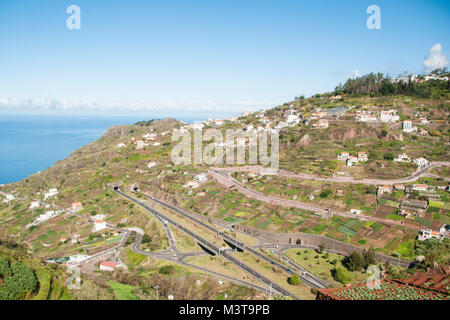 A view of Madeira`s network of roads and tunnels taken high up from a cable car over Funchal Madeira. Stock Photo